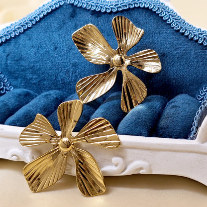 Gold floral earrings aesthetic display velvet styling