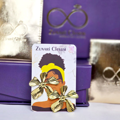 Zunari Charm packaging with gold statement earrings