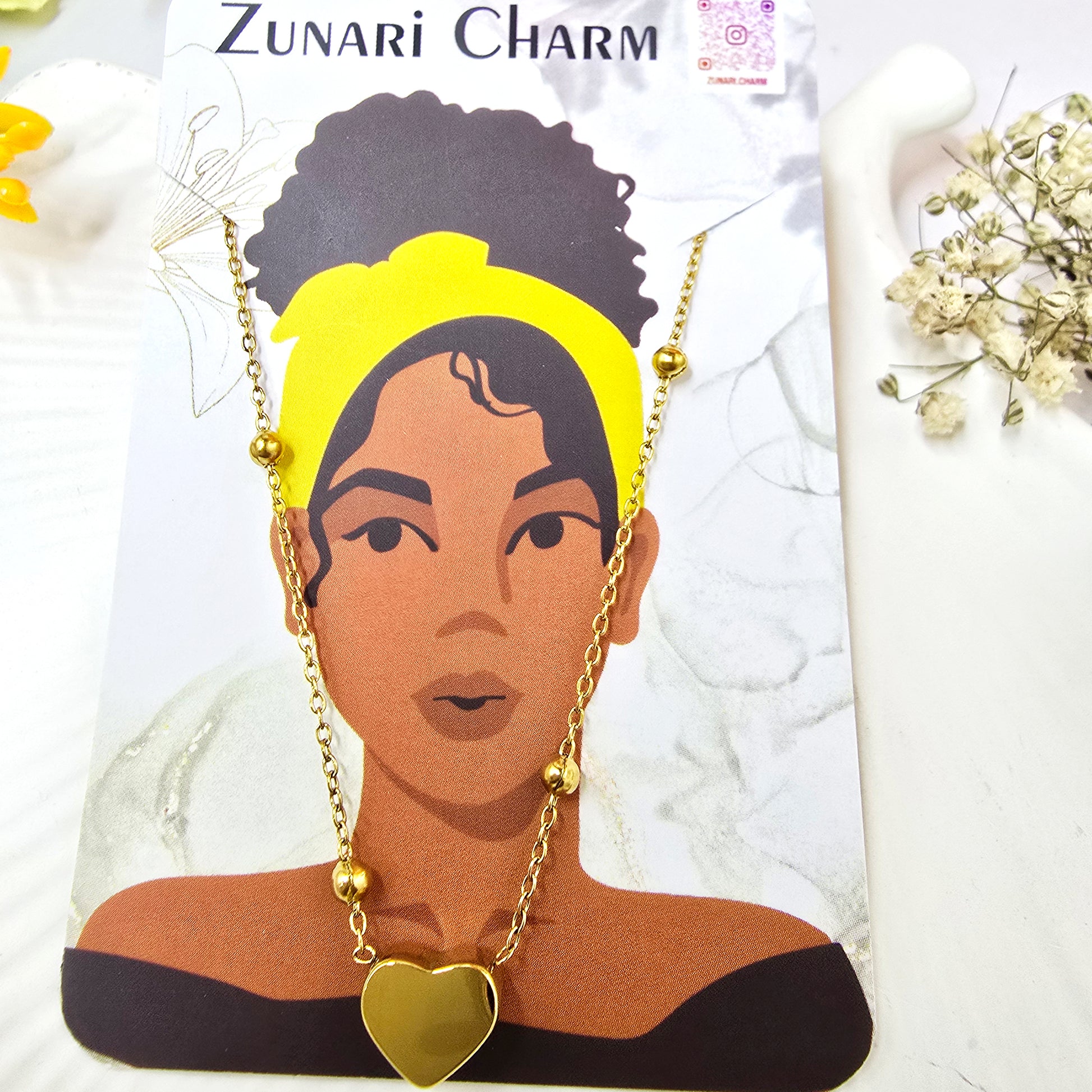 Heart Bead Necklace on Zunari Charm packaging card with delicate bead detailing.