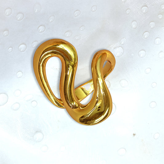 Close-up of Zunari Charm Infinity Flow Ring with abstract fluid curves, displayed on white background with water drop texture.