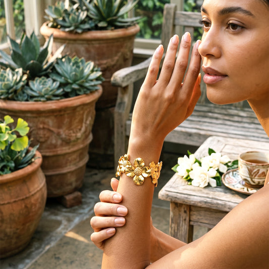 Woman wearing Jardin gold flower cuff bracelet styling