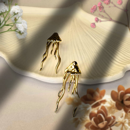 unique gold earrings with flowing design statement jewelry