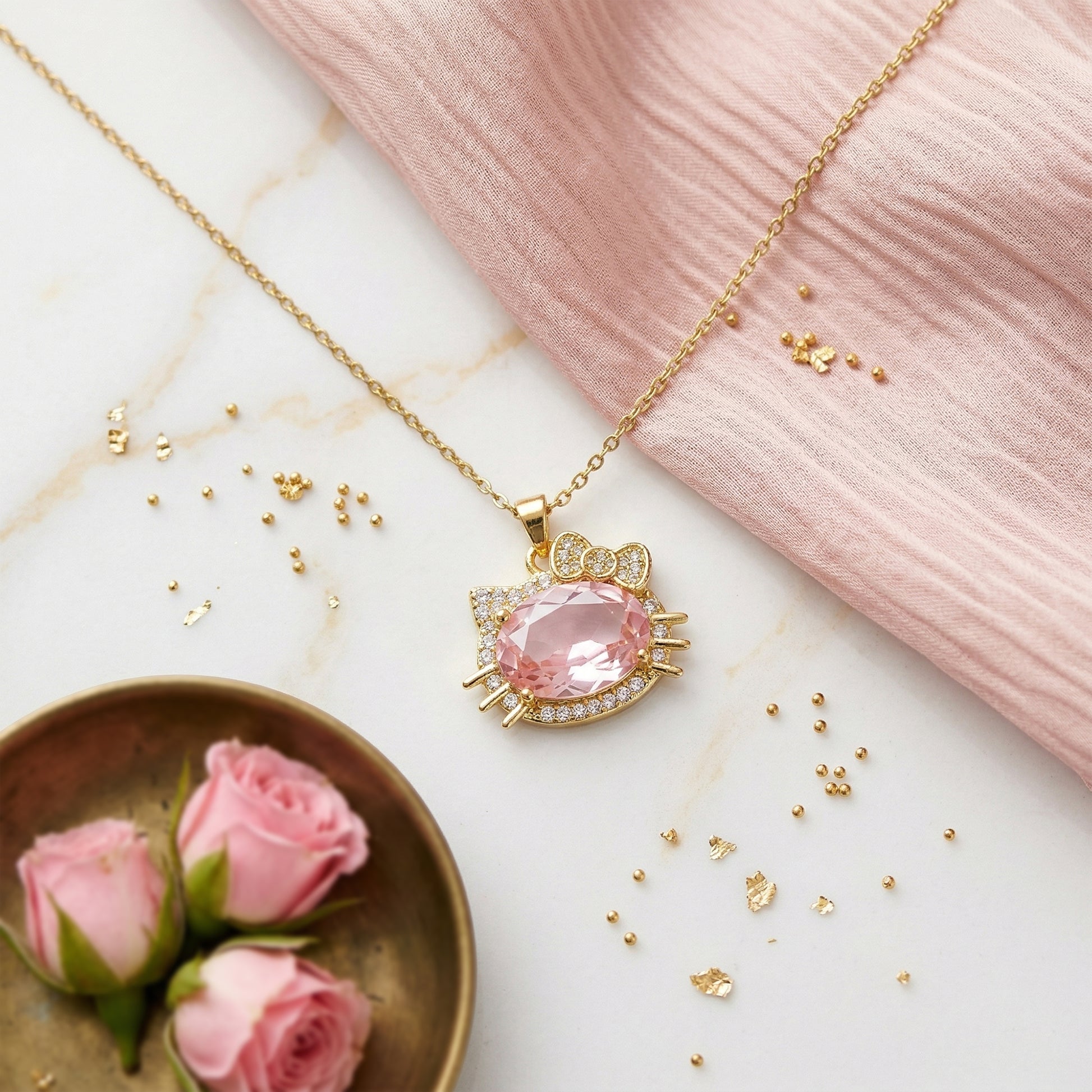 cute gold pendant necklace flatlay pink aesthetic styling