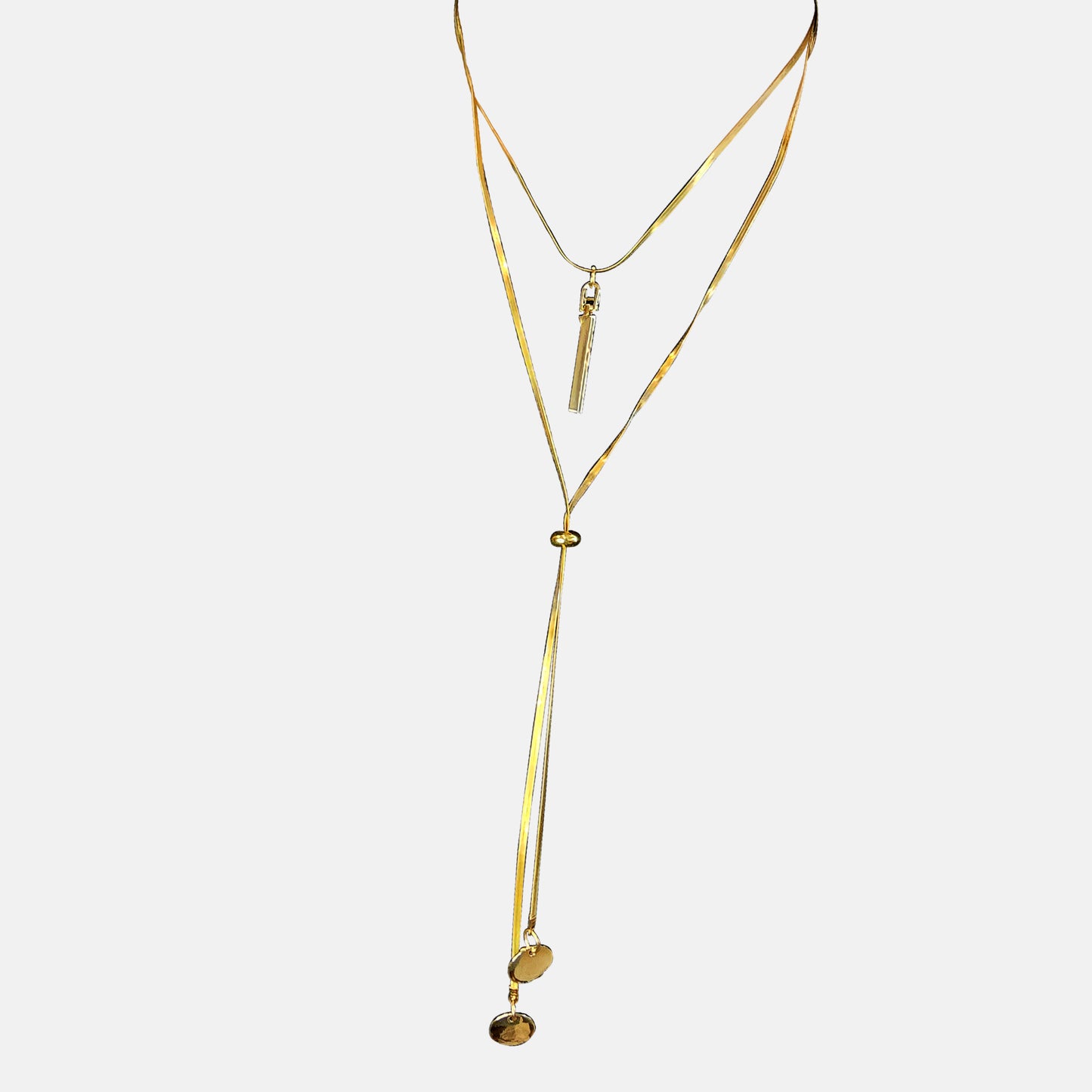 Layered Charm Drop Necklace isolated on white background – gold-toned chain