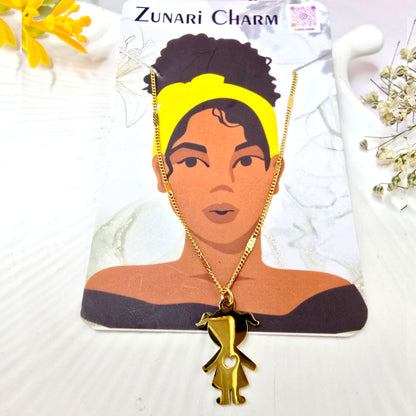 Zunari Charm gold little girl pendant displayed on a brand jewelry card.