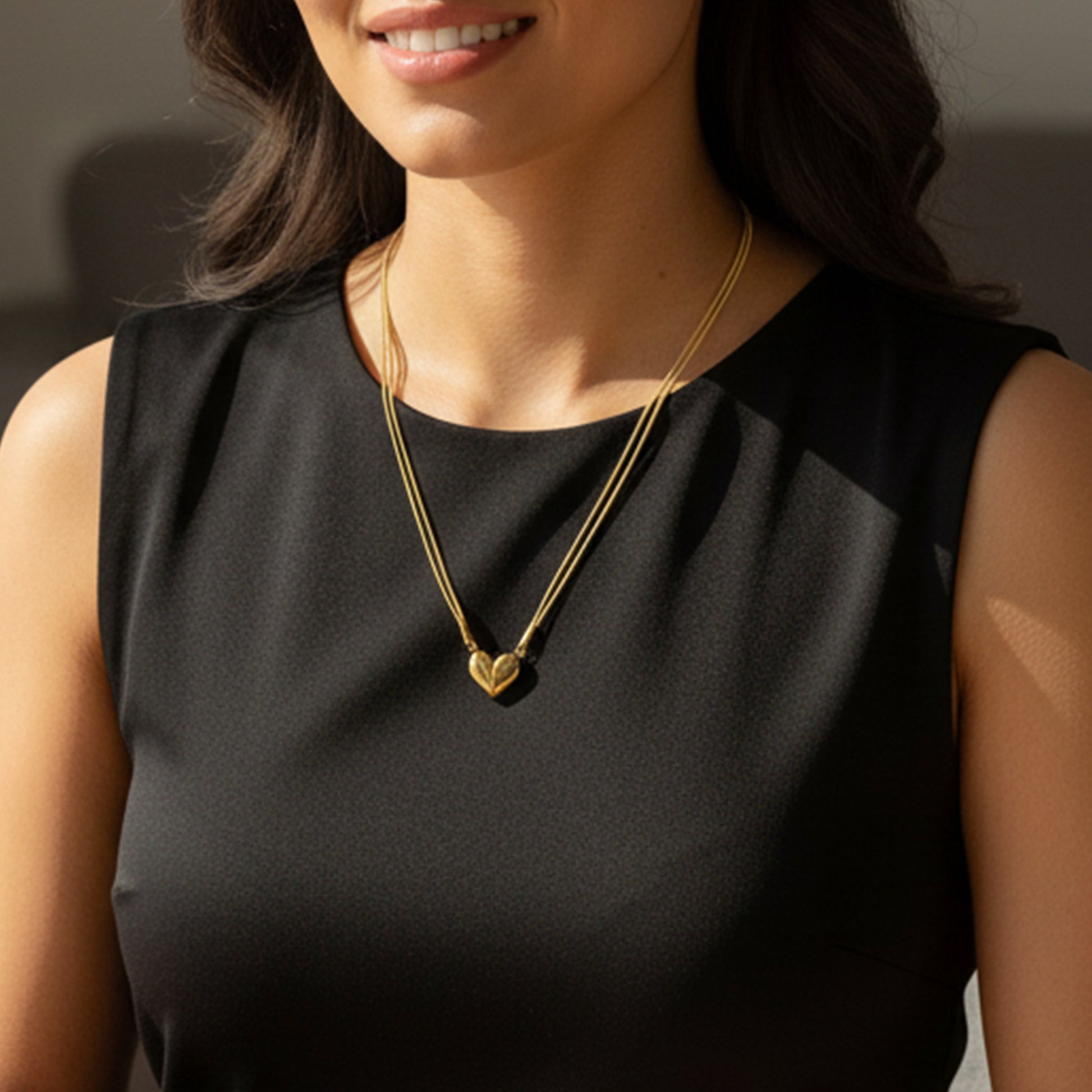Model wearing Magnetic Heart Pendant Chain – gold dual-chain necklace symbolizing love connection.