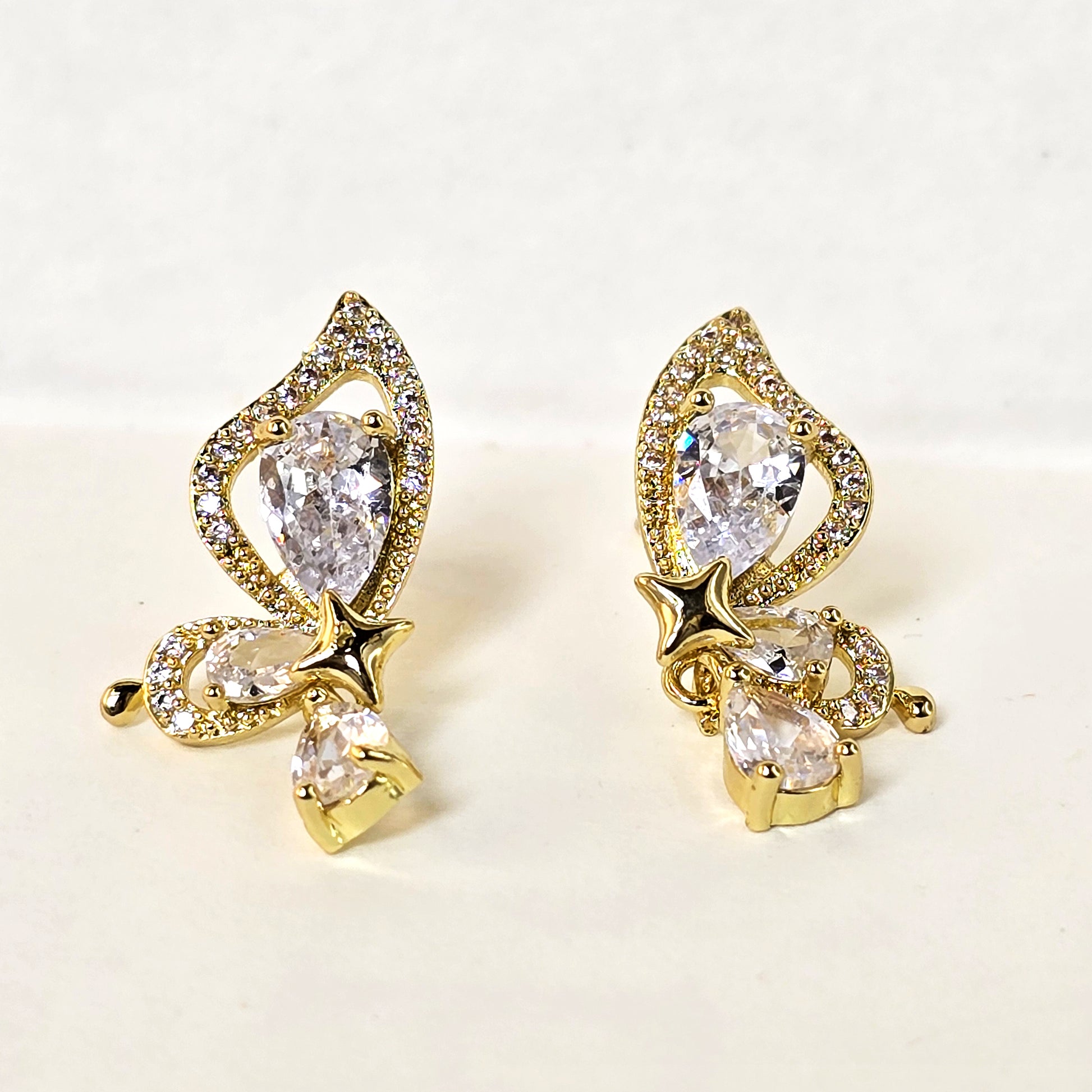 anti tarnish gold butterfly drop earrings crystal detailing close up