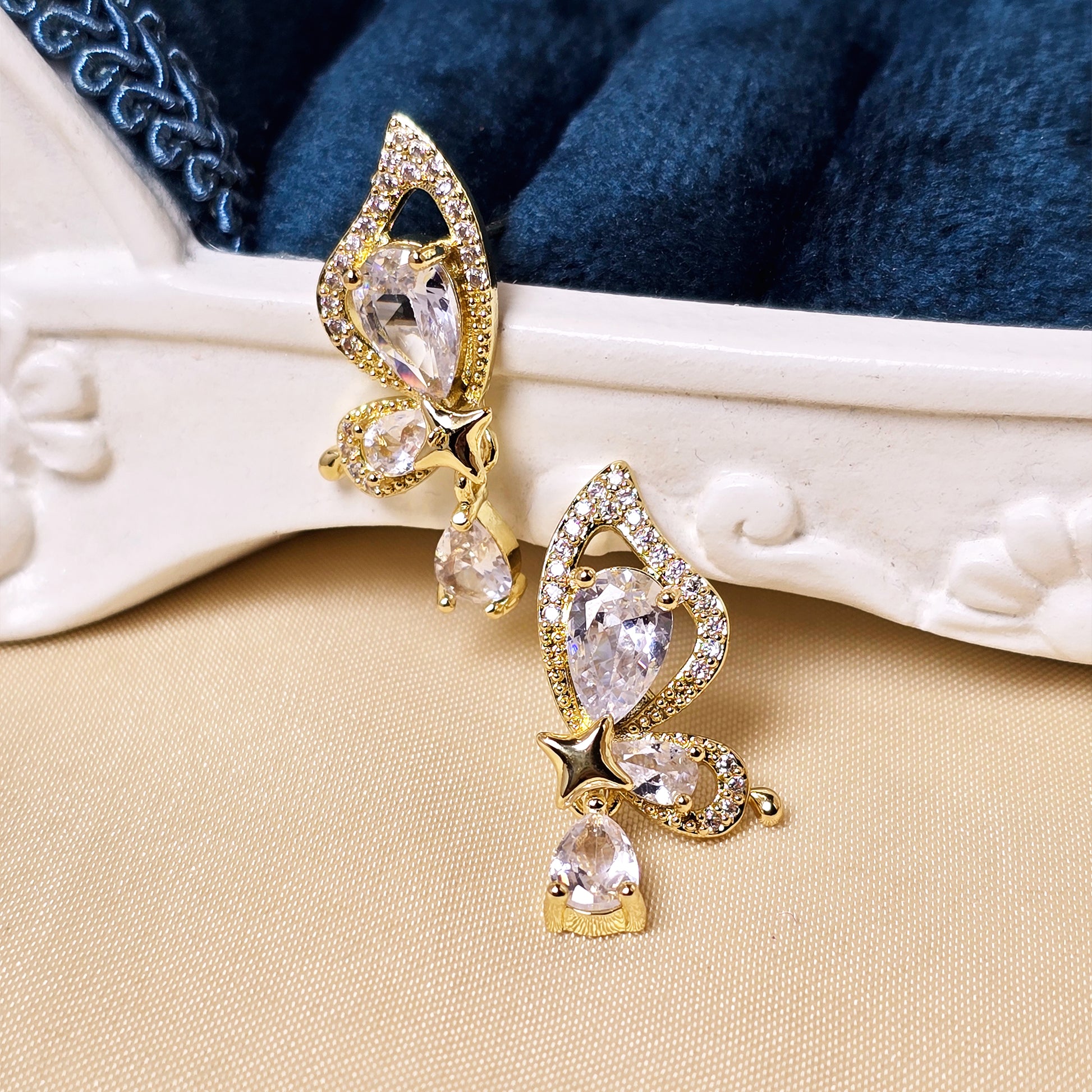 elegant crystal drop earrings flat lay luxury jewelry styling