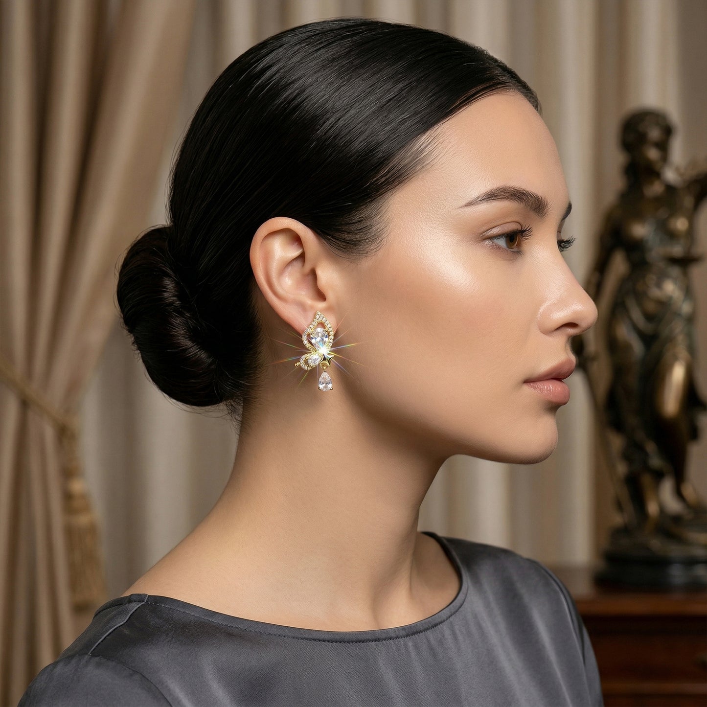 mariposa drop earrings on model gold butterfly crystal earrings