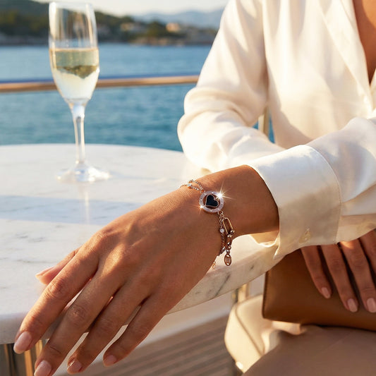 Woman wearing the Midnight Spade Bracelet, showing the size of the petite black charm.