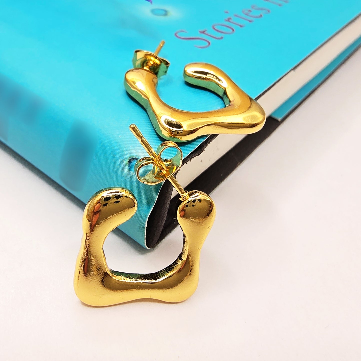 Close-up of Modern Melt Earrings with molten-inspired design