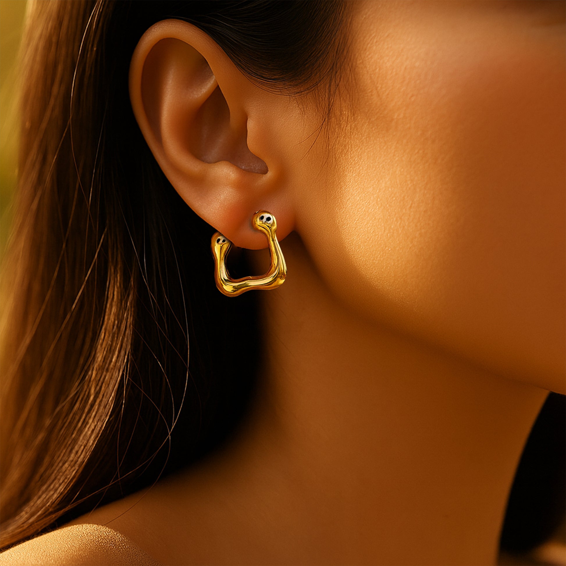Lifestyle image – Modern Melt Earrings worn on model’s ear