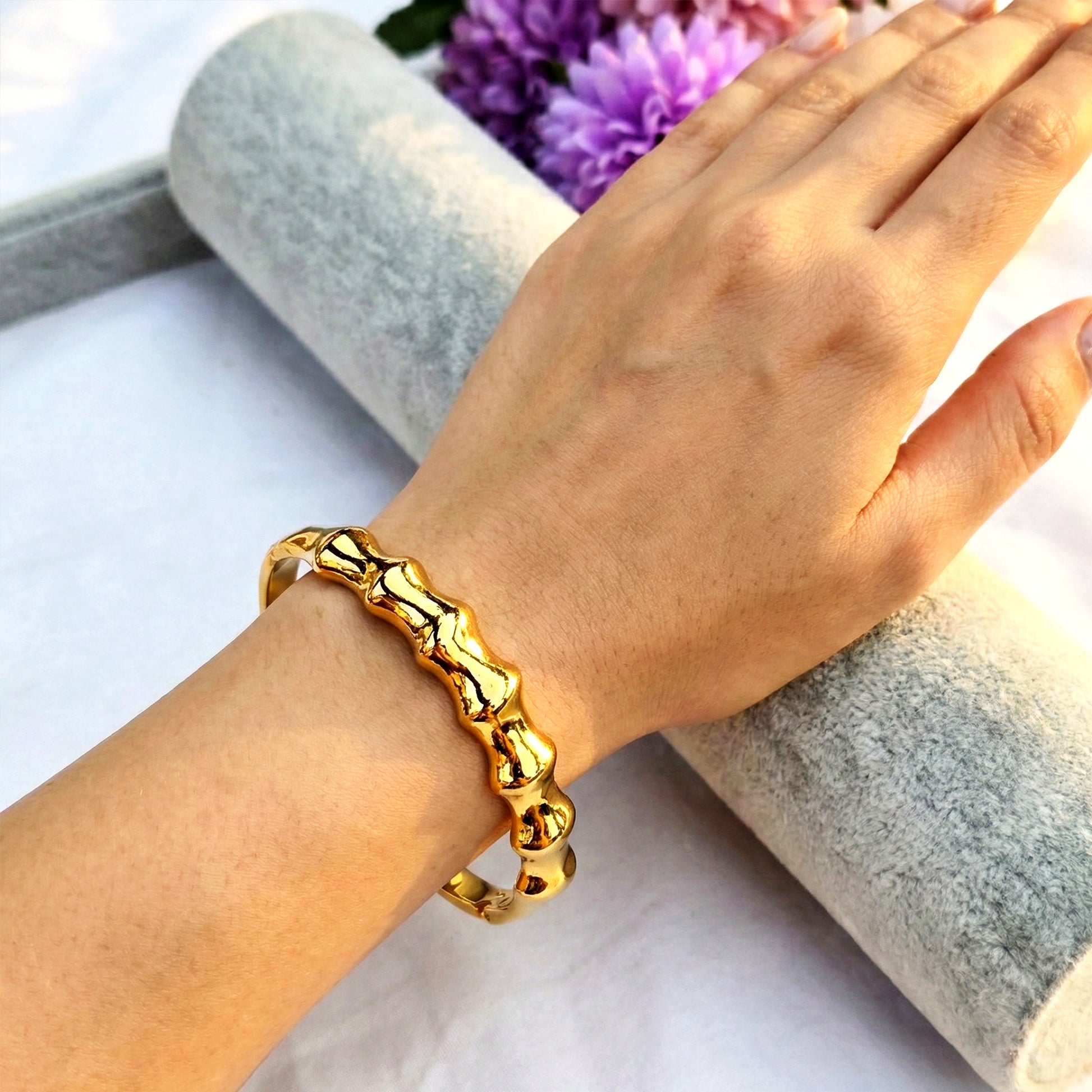 Molten Ridge gold sculptural cuff bracelet worn on wrist