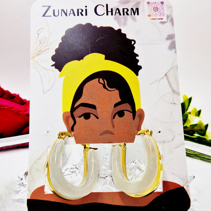 Moonlit Loop Earrings – model wearing ivory and gold chic hoop earrings