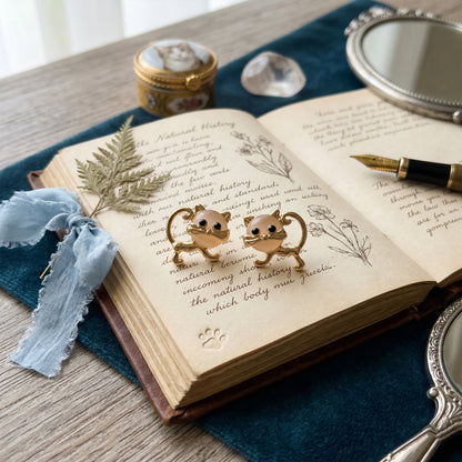 Moonstone Meow cat earrings gold studs aesthetic flatlay vintage book styling