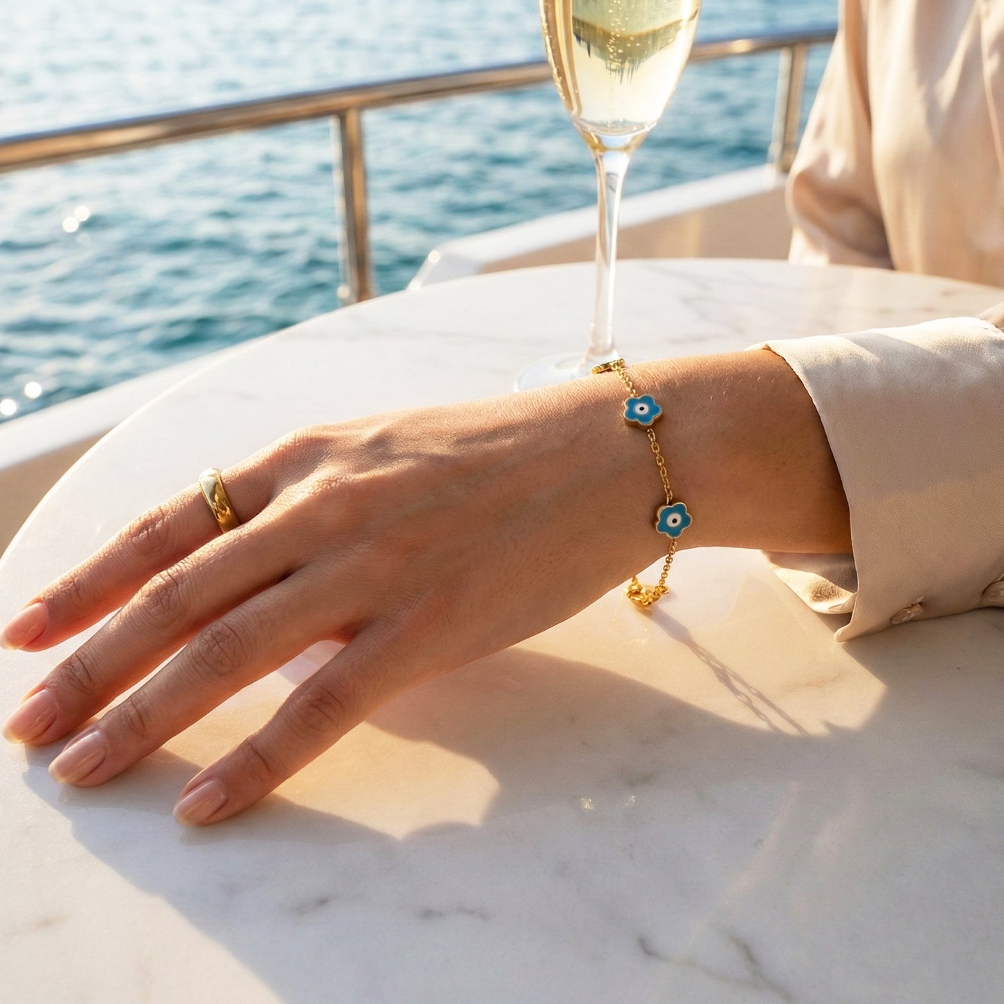 Woman wearing the Mystic Teal Bracelet, showing the contrast of the turquoise enamel against the skin.