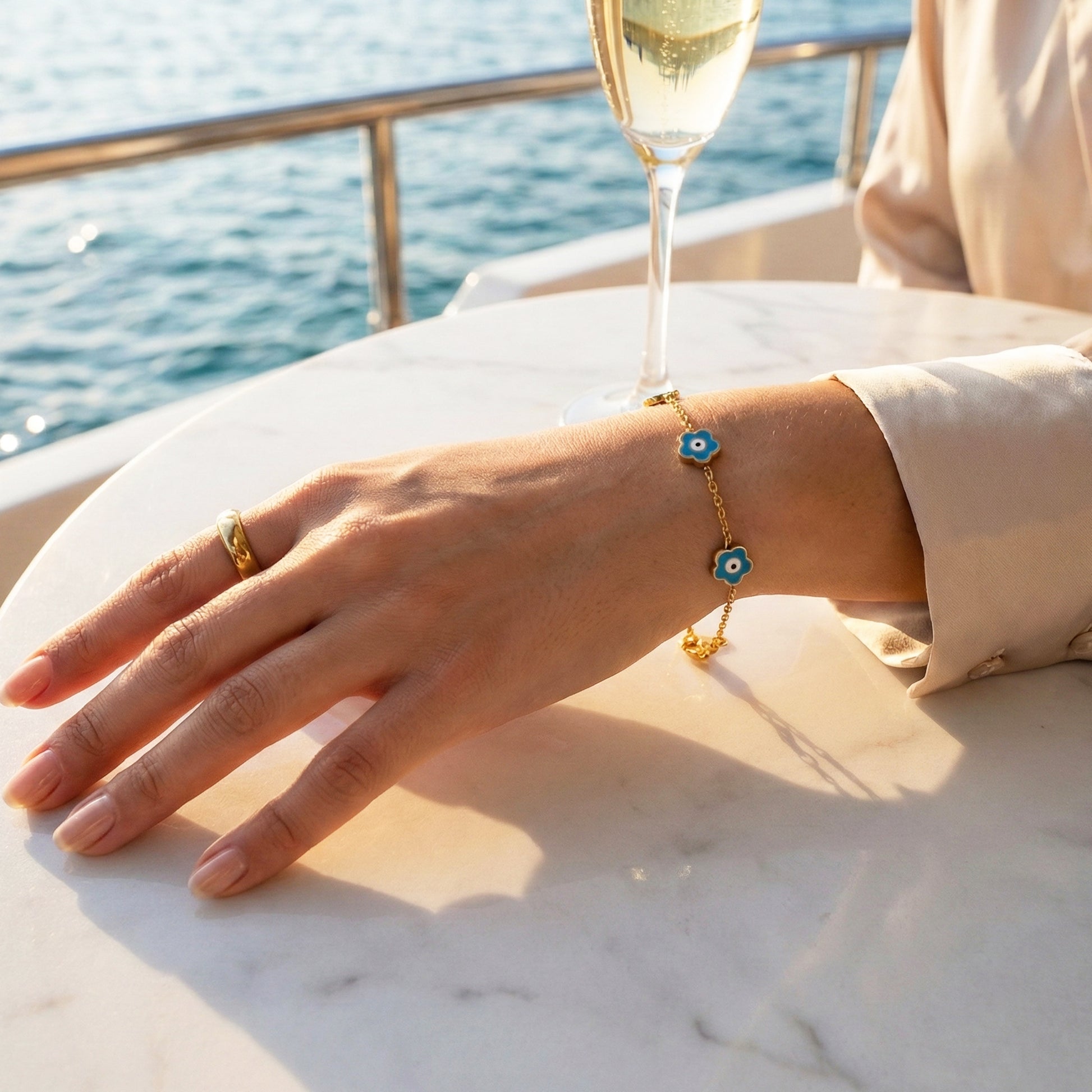 Woman wearing the Mystic Teal Bracelet, showing the contrast of the turquoise enamel against the skin.