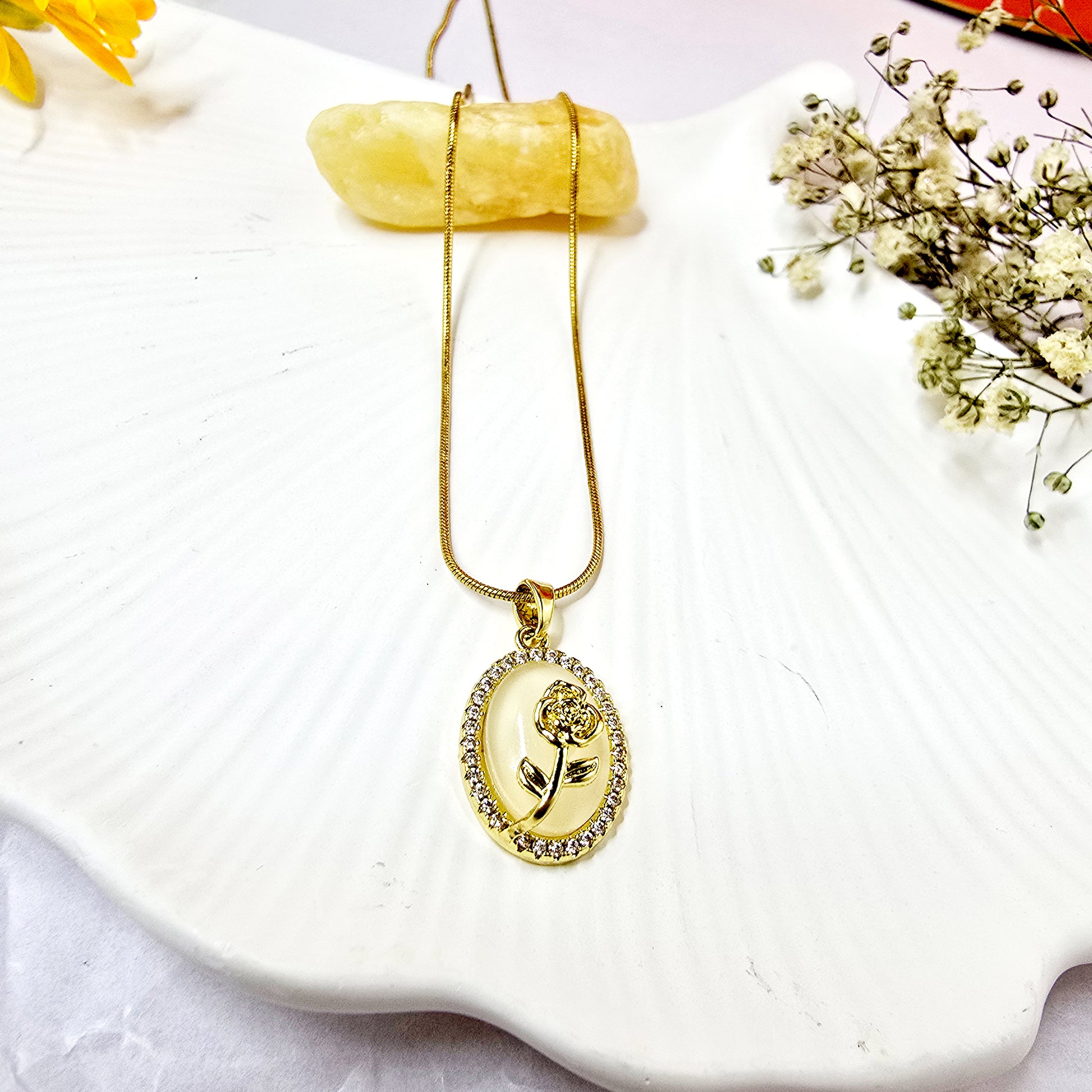 Opal Flower Pendant Chain displayed on white shell background with gold floral pendant and crystal border.