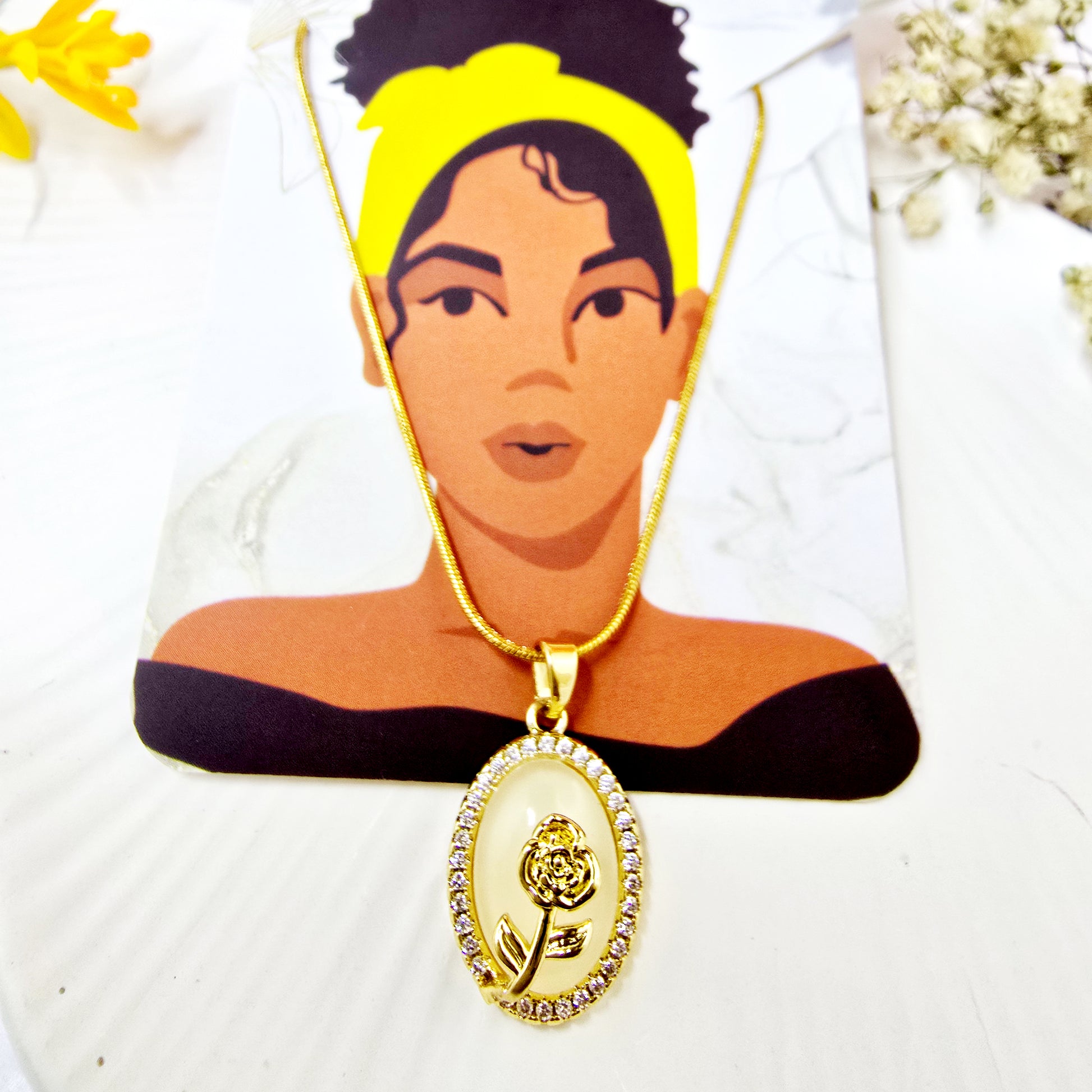 Necklace on Zunari Charm packaging card highlighting opal base & floral motif.