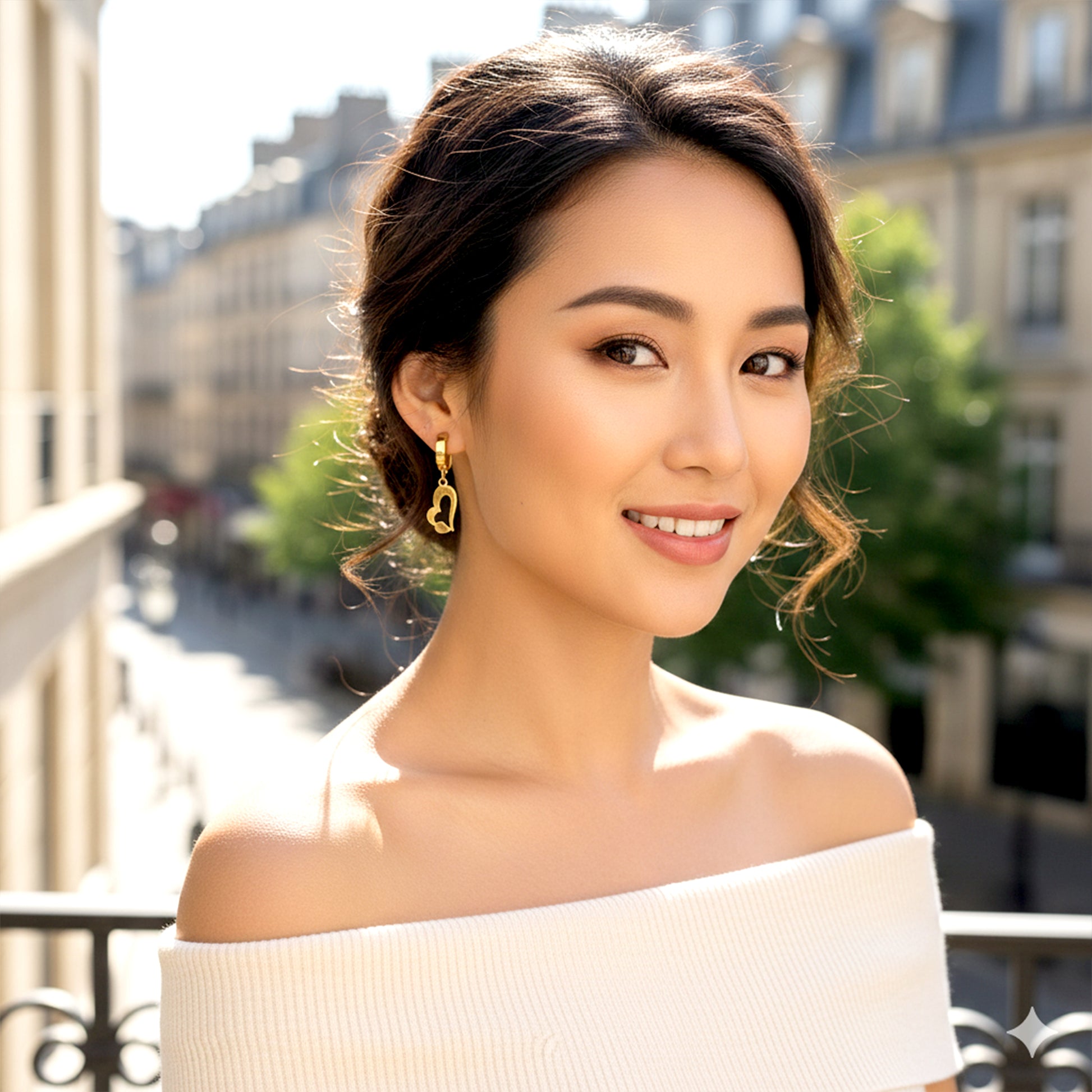 model wearing gold heart hoop earrings elegant look