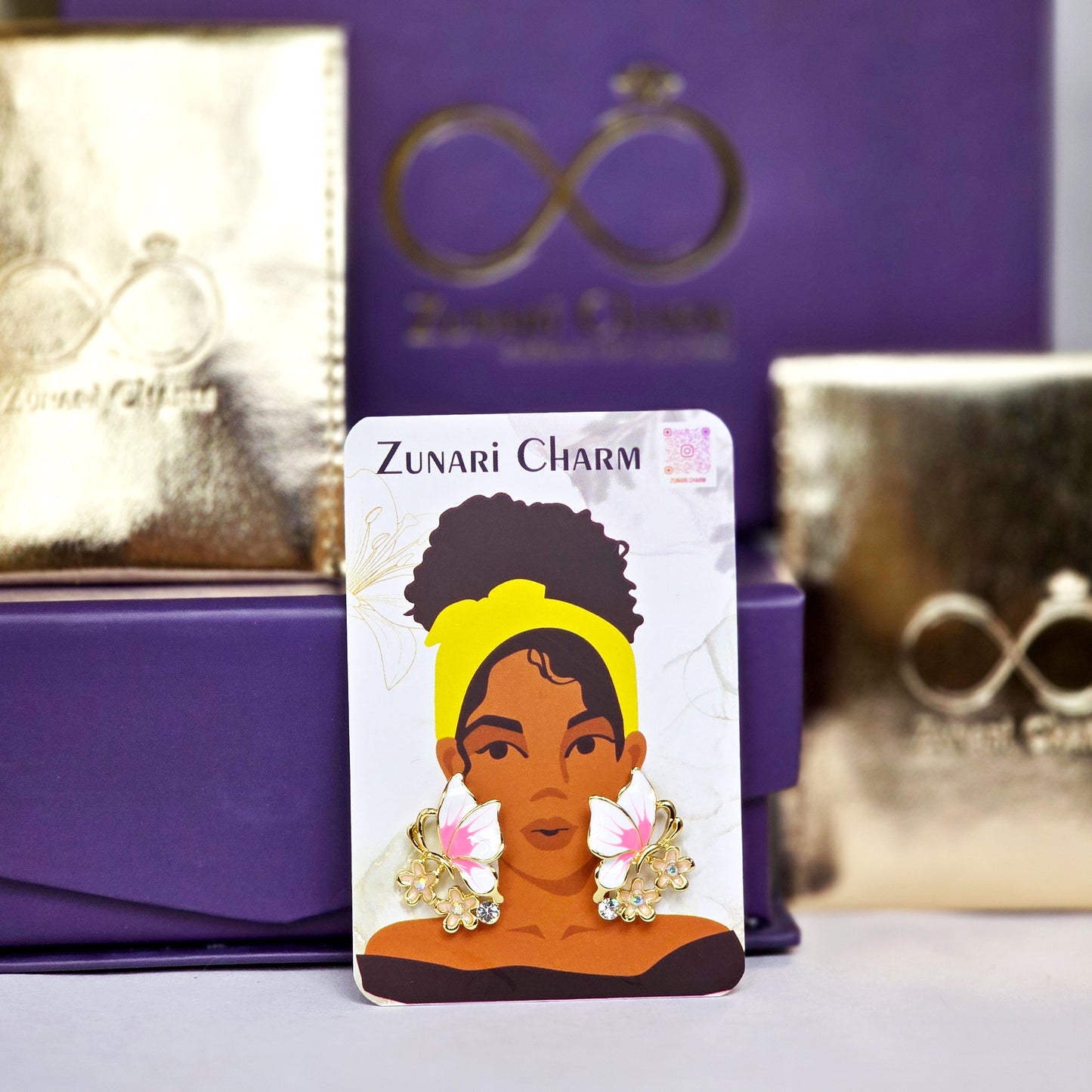 Zunari Charm packaging with butterfly earrings display