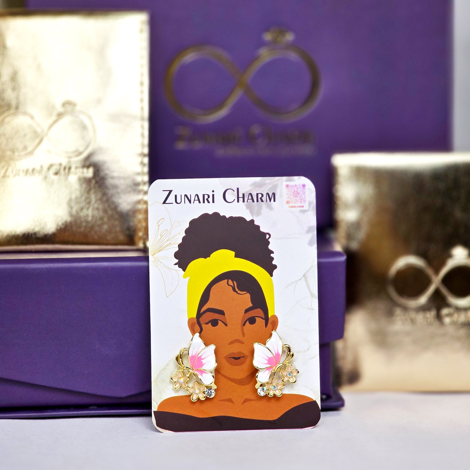 Zunari Charm packaging with butterfly earrings display