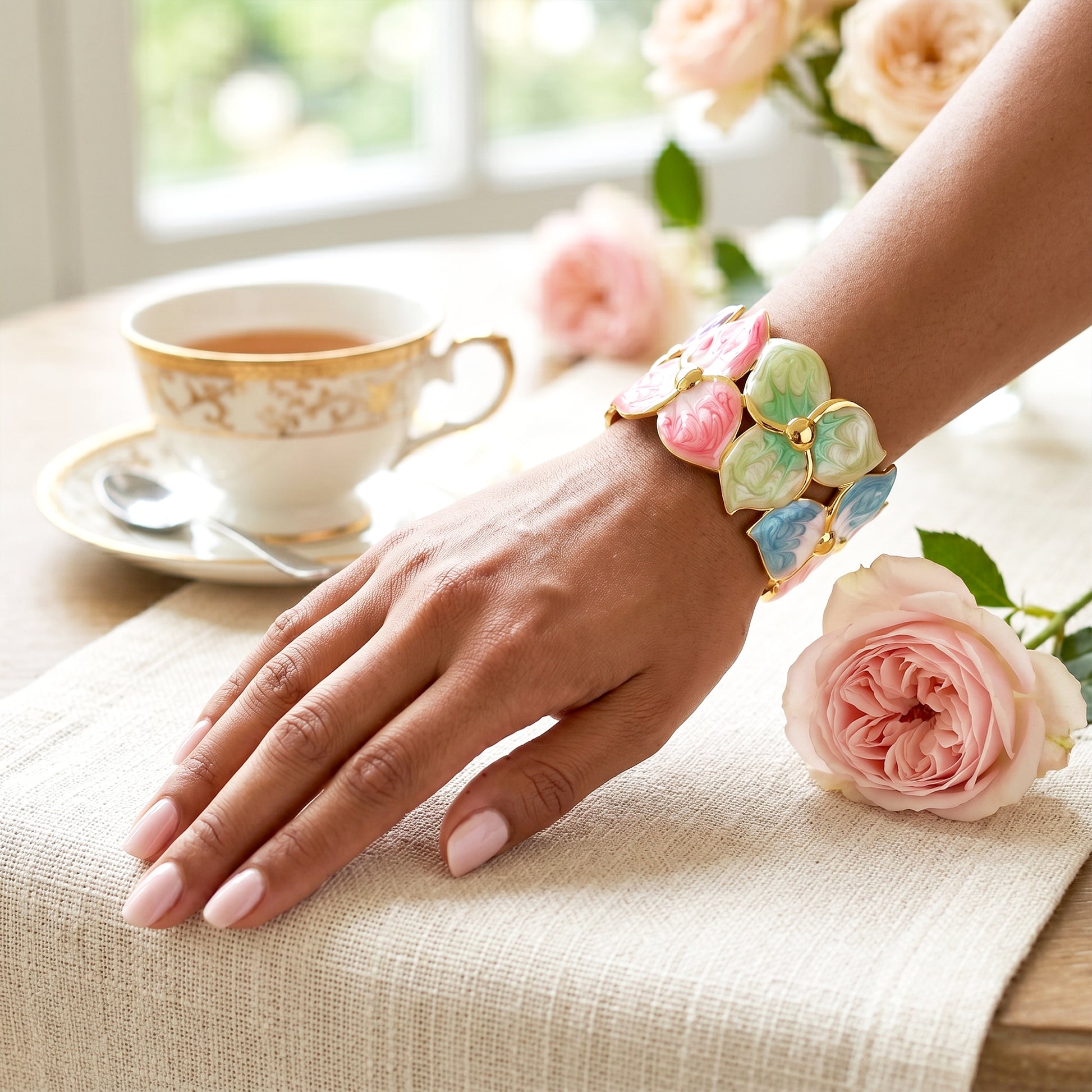 Woman wearing Rainbow Petal gold cuff bracelet styling