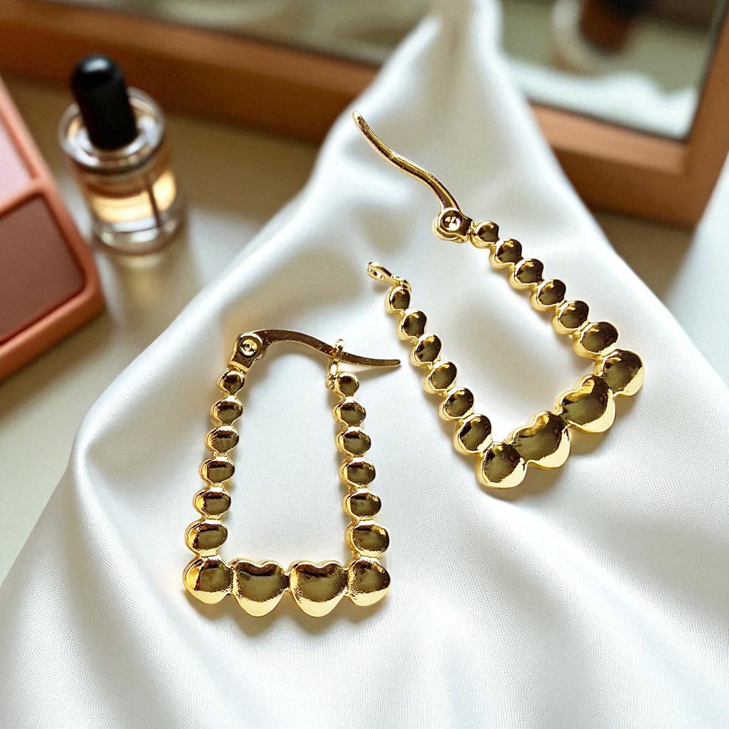 Rectangle Heart Hoop Earrings – bold heart-accented hoops on satin fabric with perfume