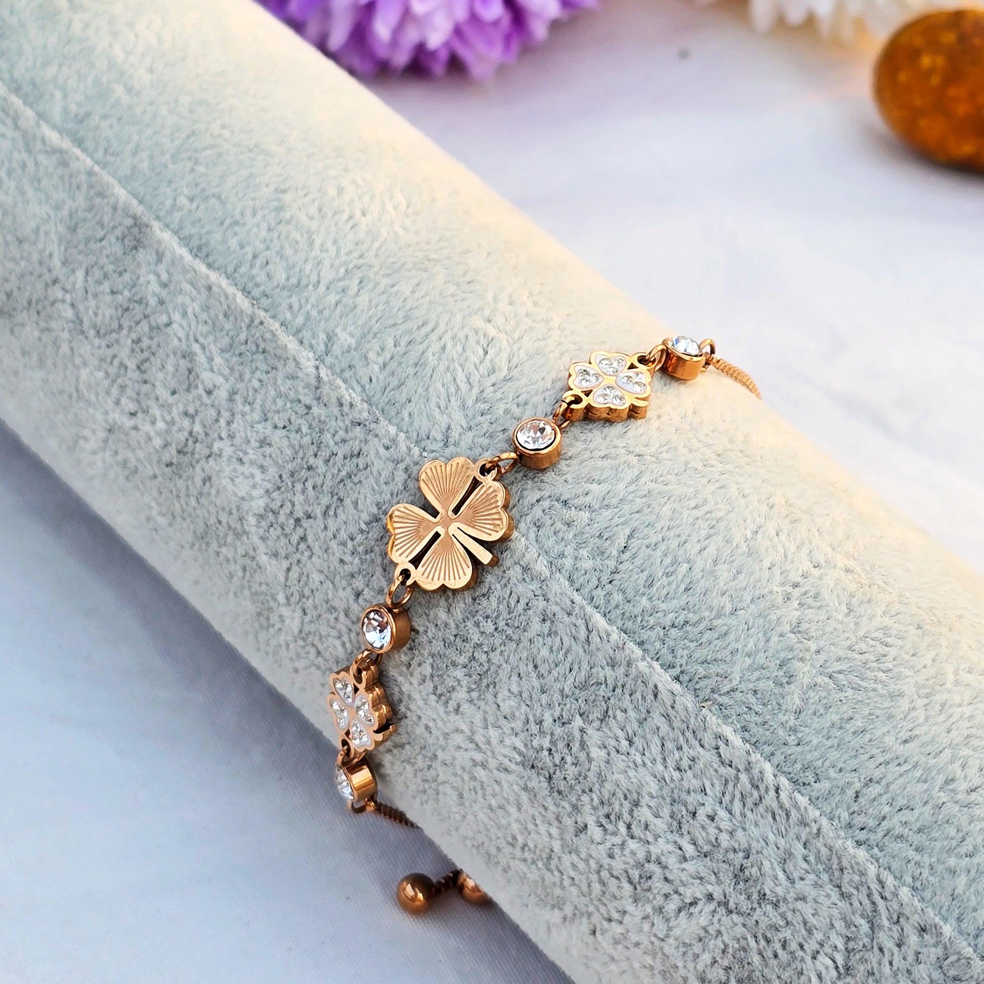 Side view of gold cable chain bracelet showing the clasp and extender chain.