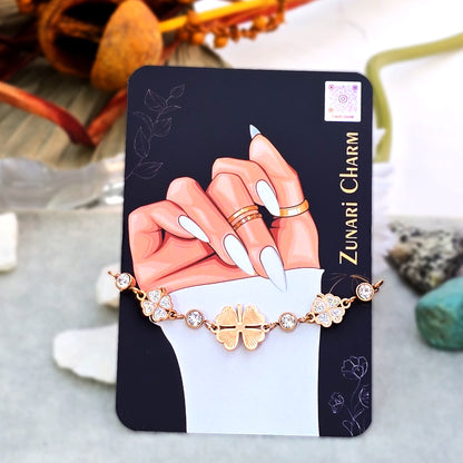 White/Pearl four-leaf clover bracelet displayed on Zunari Charm packaging.