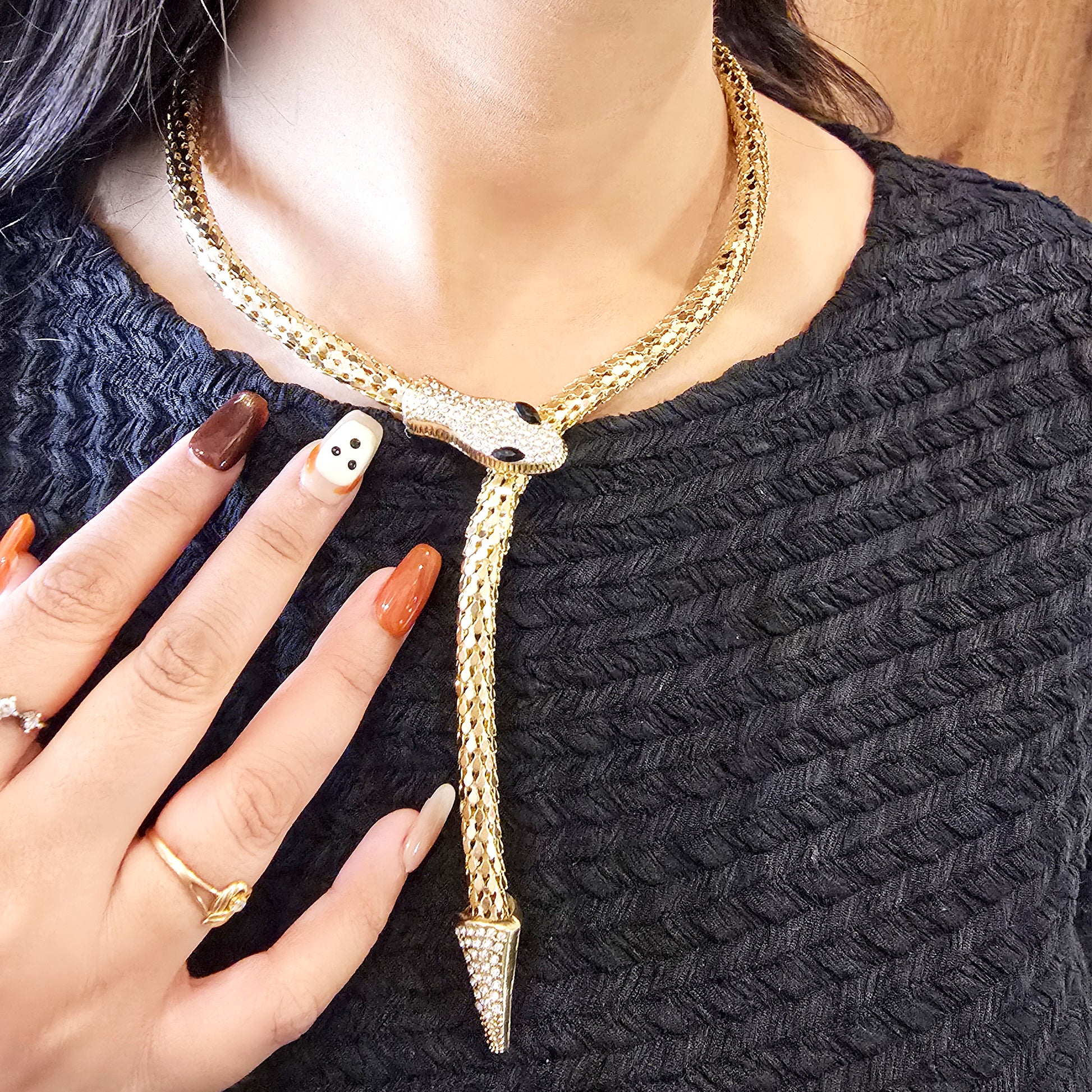 Model wearing Serpent Embrace Necklace – gold snake choker with crystals