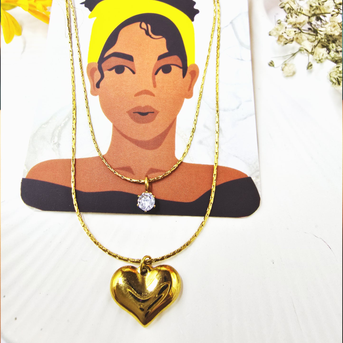 Necklace displayed on Zunari Charm packaging card highlighting dual-layer design.