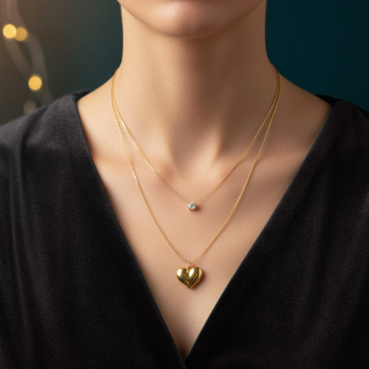 Model wearing Shine in Love Pendant Chain – layered gold necklace with heart and crystal charms.