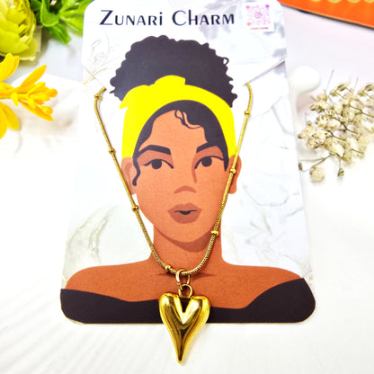 Necklace displayed with Zunari Charm card – gold pendant chain branding