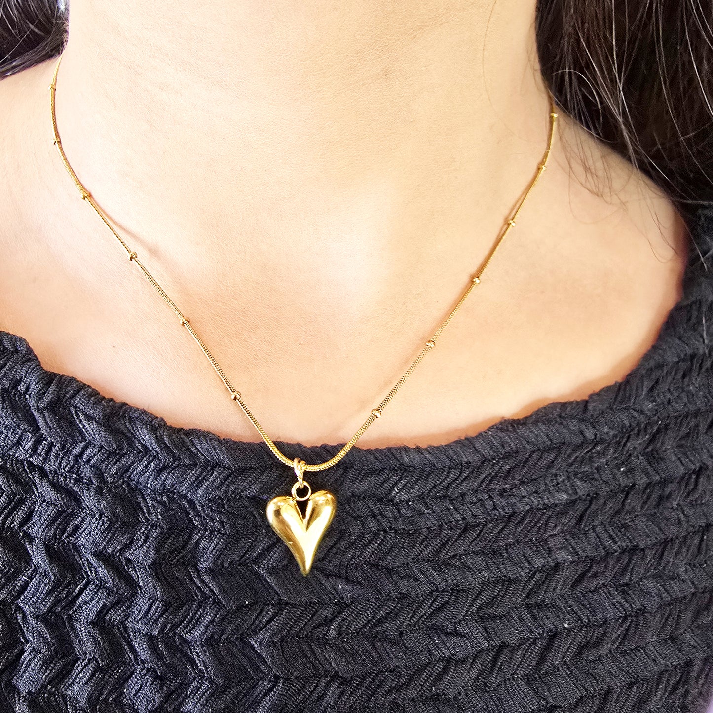 Model wearing TearDrop Heart Pendant Chain – gold beaded chain with teardrop heart pendant