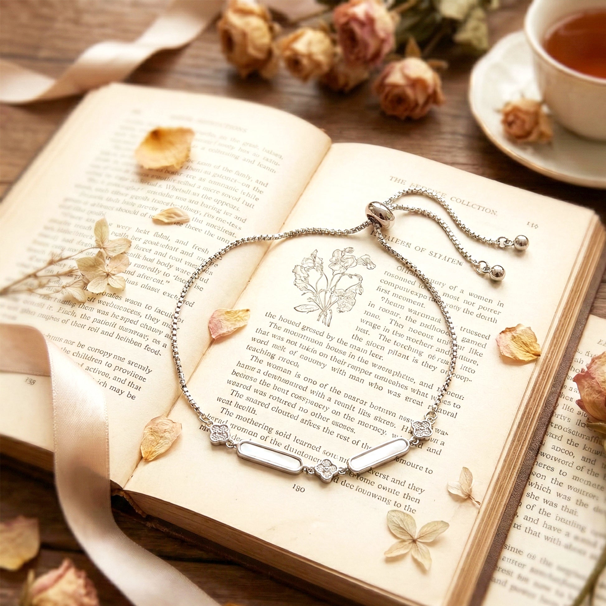 Close-up macro shot of the pave setting on the silver bar, resting on a book.