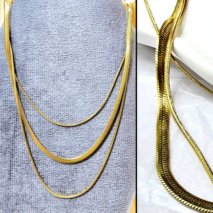 Close-up of Trinity Layers Necklace texture and shine – anti-tarnish gold chain.