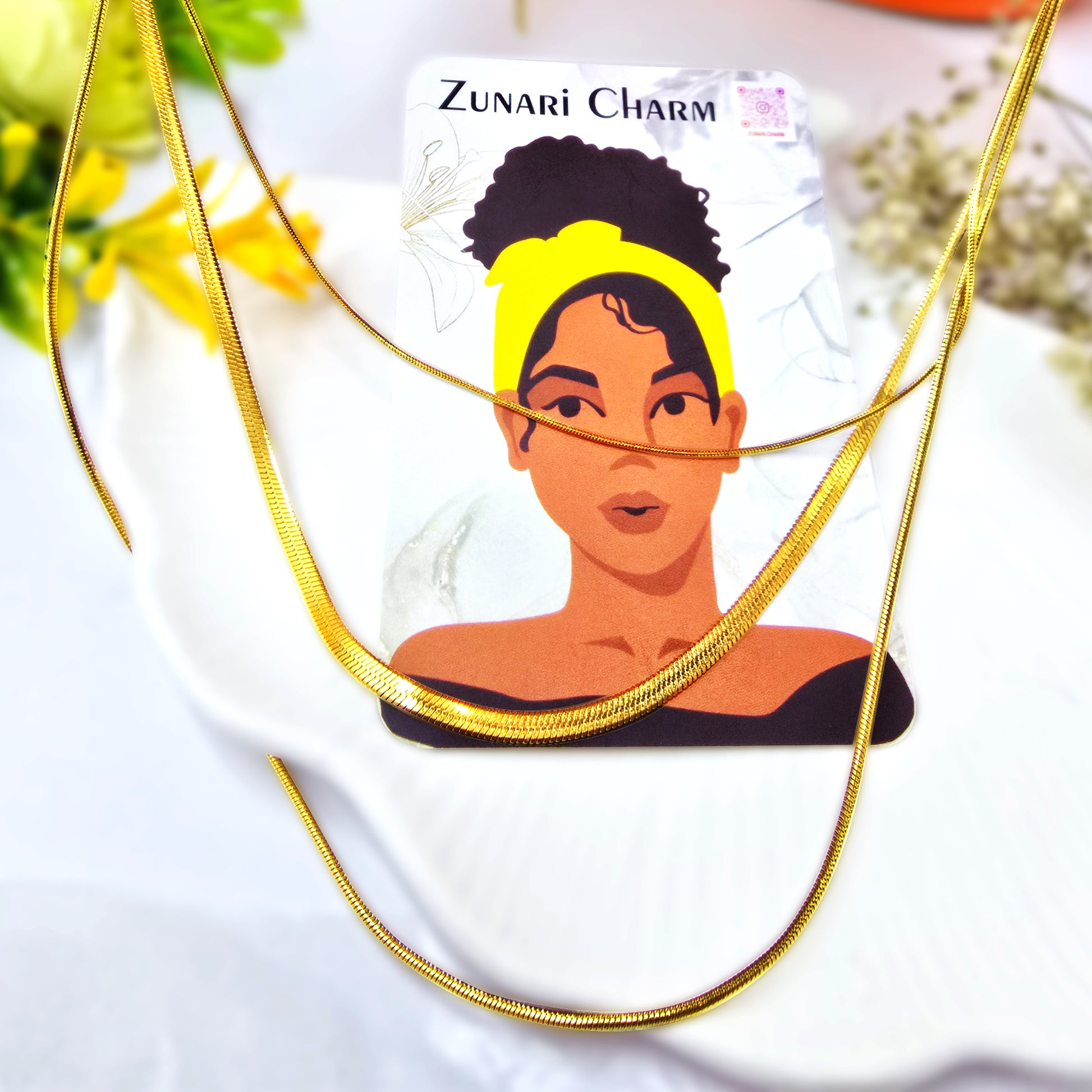 Trinity Layers Necklace styled on Zunari Charm display card – chic gold accessory.