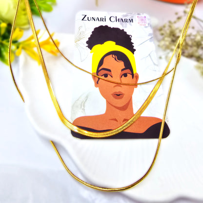 Trinity Layers Necklace styled on Zunari Charm display card – chic gold accessory.