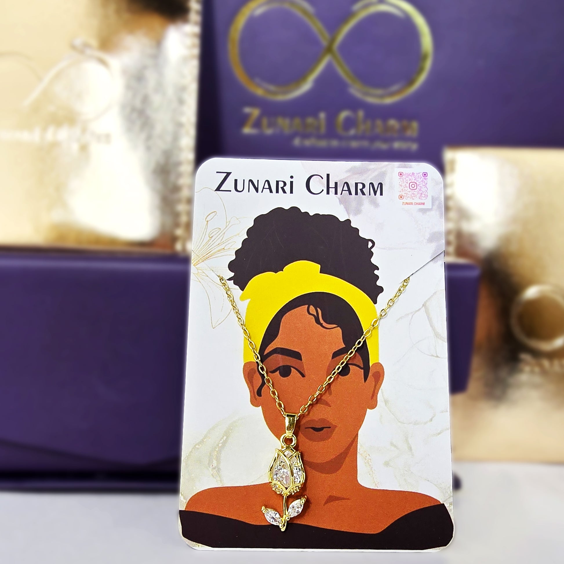 Zunari Charm gold tulip pendant necklace on branded packaging card premium jewelry presentation