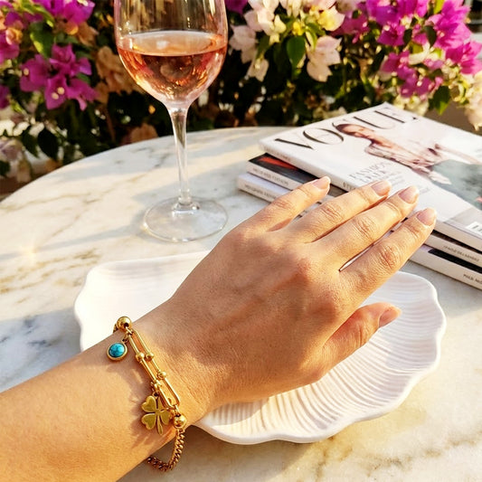 Woman wearing the U-Link Lucky Charm bracelet, showing how the charm dangles on the wrist.
