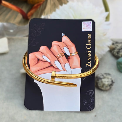 Urban Nail Bangle displayed on Zunari Charm branded packaging card.
