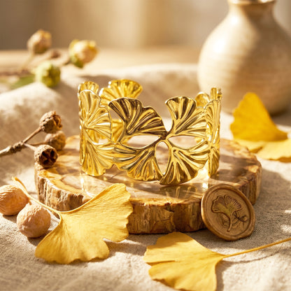 Gold open cuff bracelet with leaf cutwork design