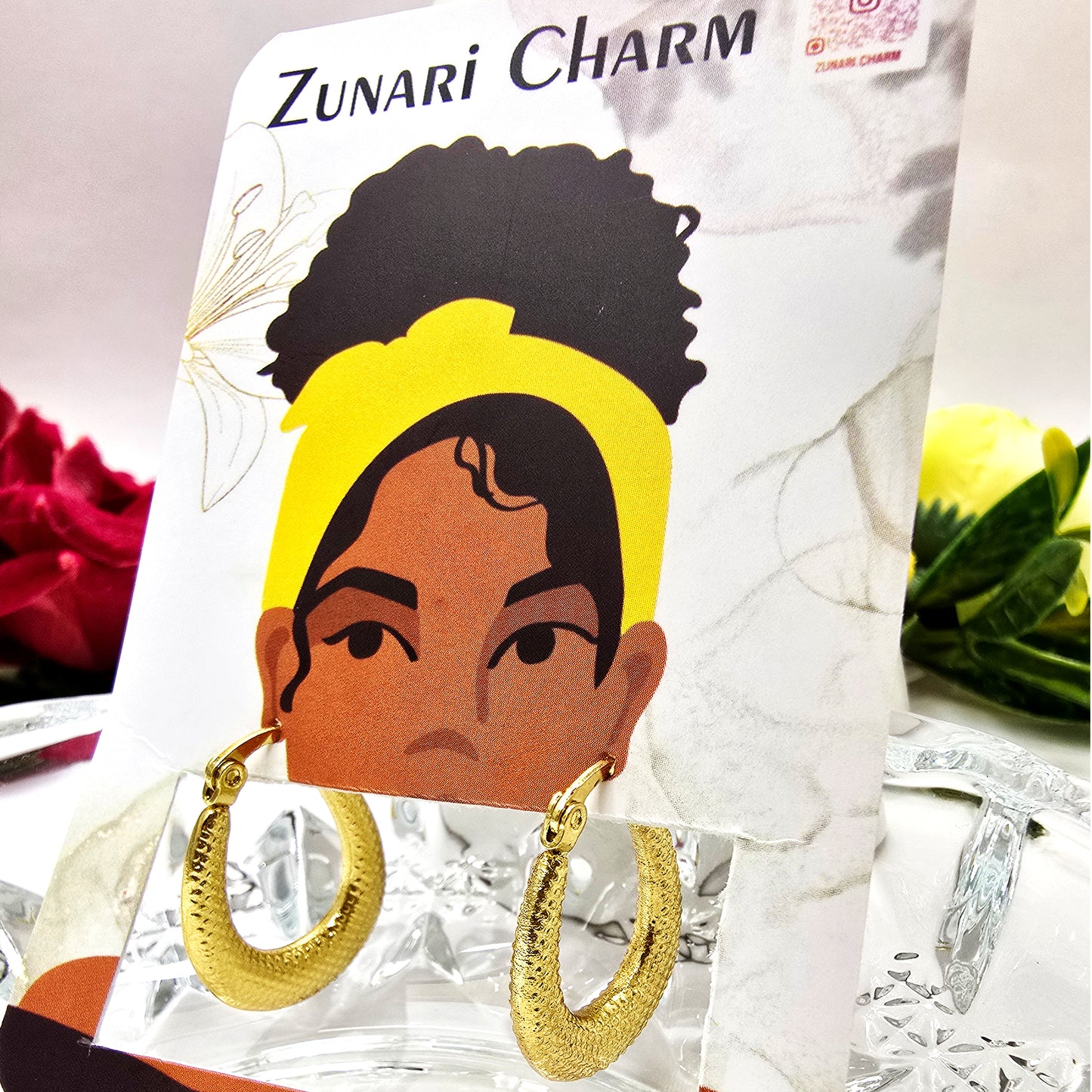 Vintage crescent hoop earrings displayed on Zunari Charm jewelry card