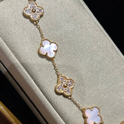 Close-up of the clover charm bracelet under soft lighting