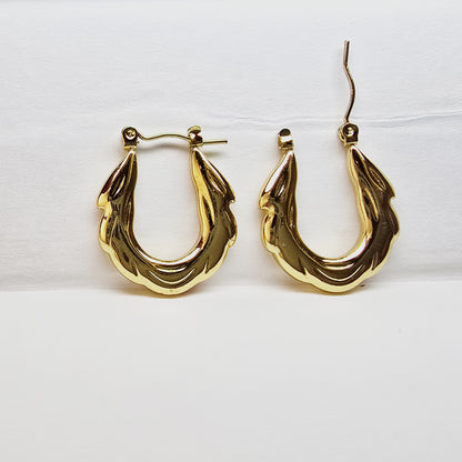 Zigzag Hoop Earrings – bold gold textured hoops on white background