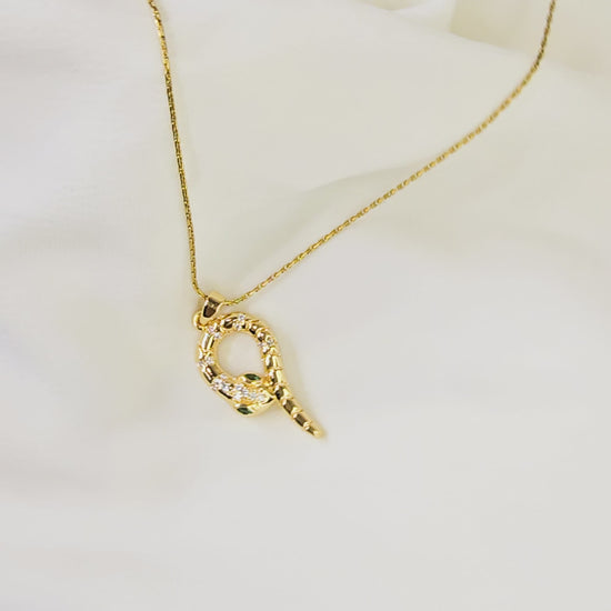 Video showing the 3D form and movement of the gold-plated coiled viper snake pendant.