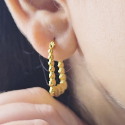 Rectangle Heart Hoop Earrings – close-up video of gold geometric hoops with bold heart-shaped accents worn on model’s ear, showcasing anti-tarnish waterproof finish and trendy statement design.