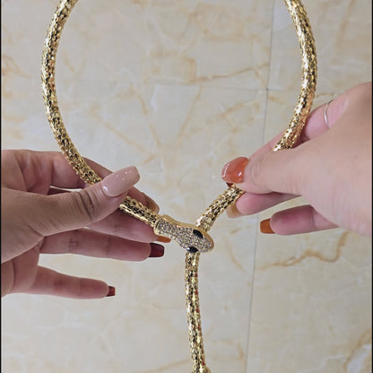 360-degree view of Serpent Embrace Necklace – gold snake choker with sparkling crystal detailing, showcasing magnetic closure feature for secure fit.
