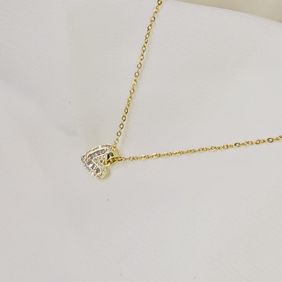 Video showing the dazzling sparkle and movement of the baguette and pavé crystal heart pendant.